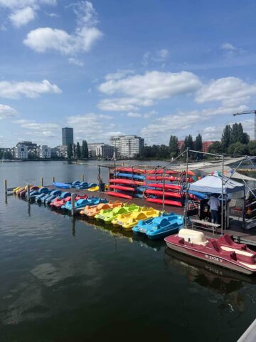 Kayak Rentals on the River: Various kayaks available for rent along the Spree River.