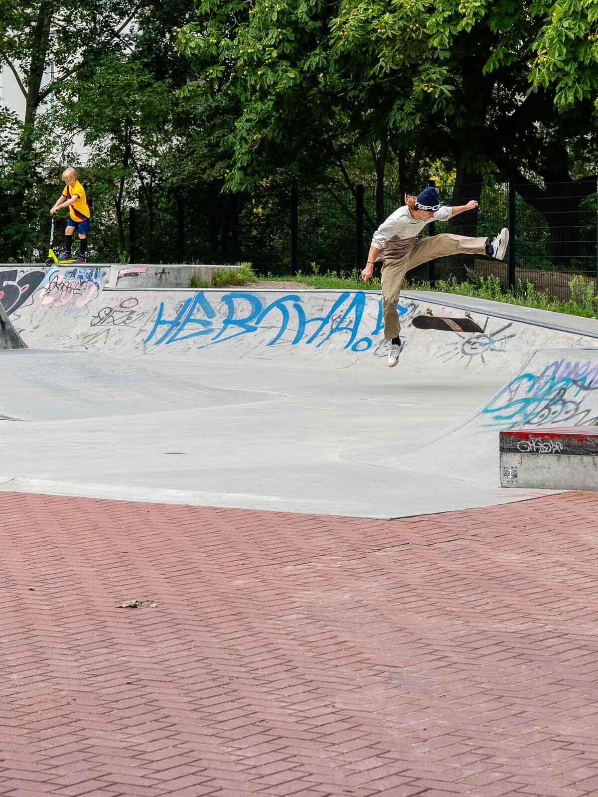 Skateboarder in Park: A skateboarder performing a trick in a skate park.