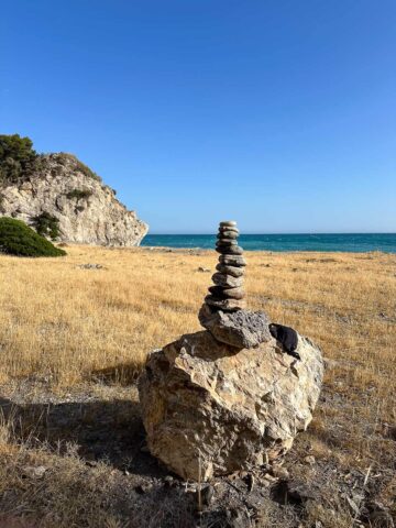 piling stones in Cantarriján beach in Nerja.