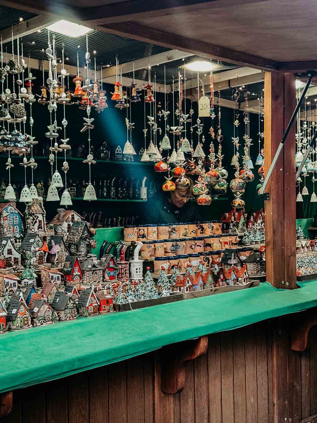 A colorful display of handcrafted Christmas ornaments and decorations at a Berlin market.