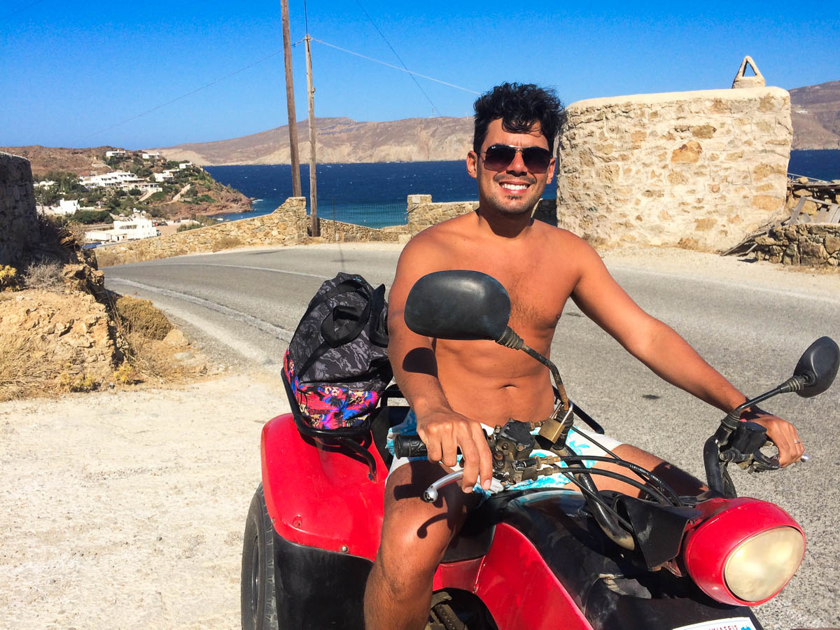 Traveler exploring Mykonos on an ATV, perfect for reaching hidden beaches.