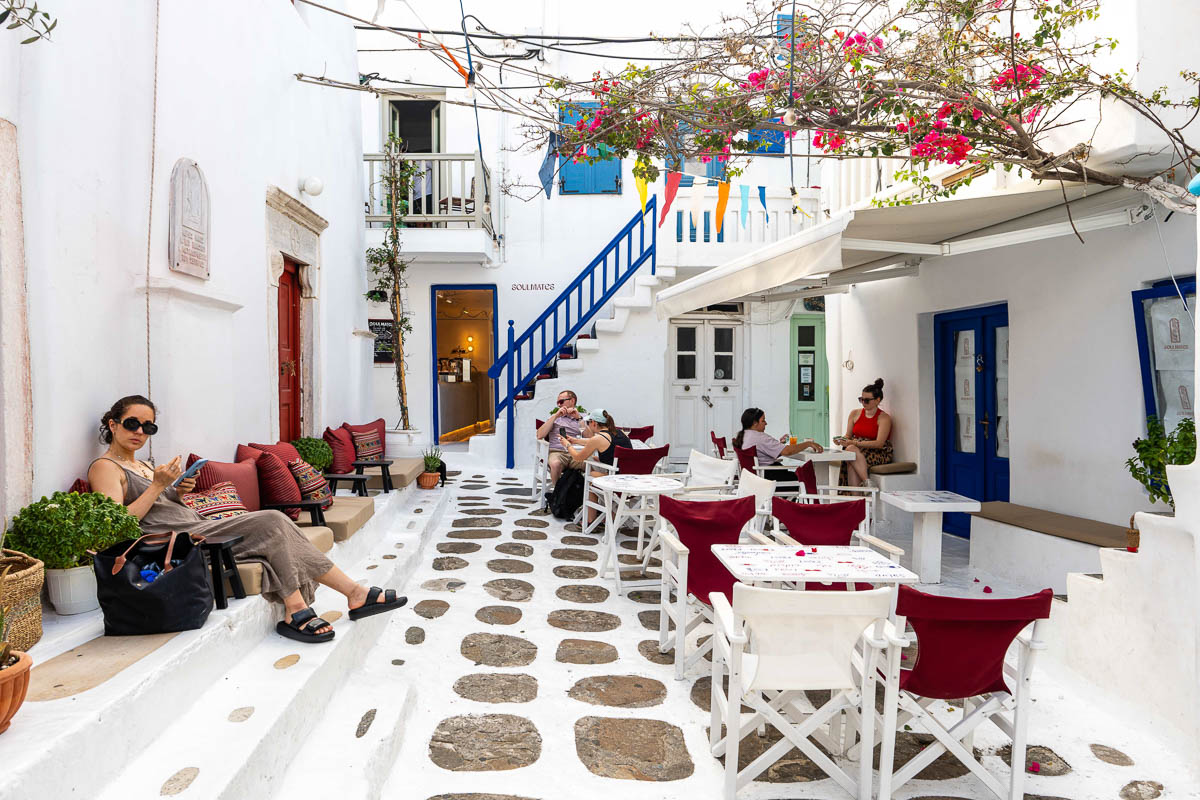 Traditional outdoor café on a cobbled lane in Chora, Mykonos.