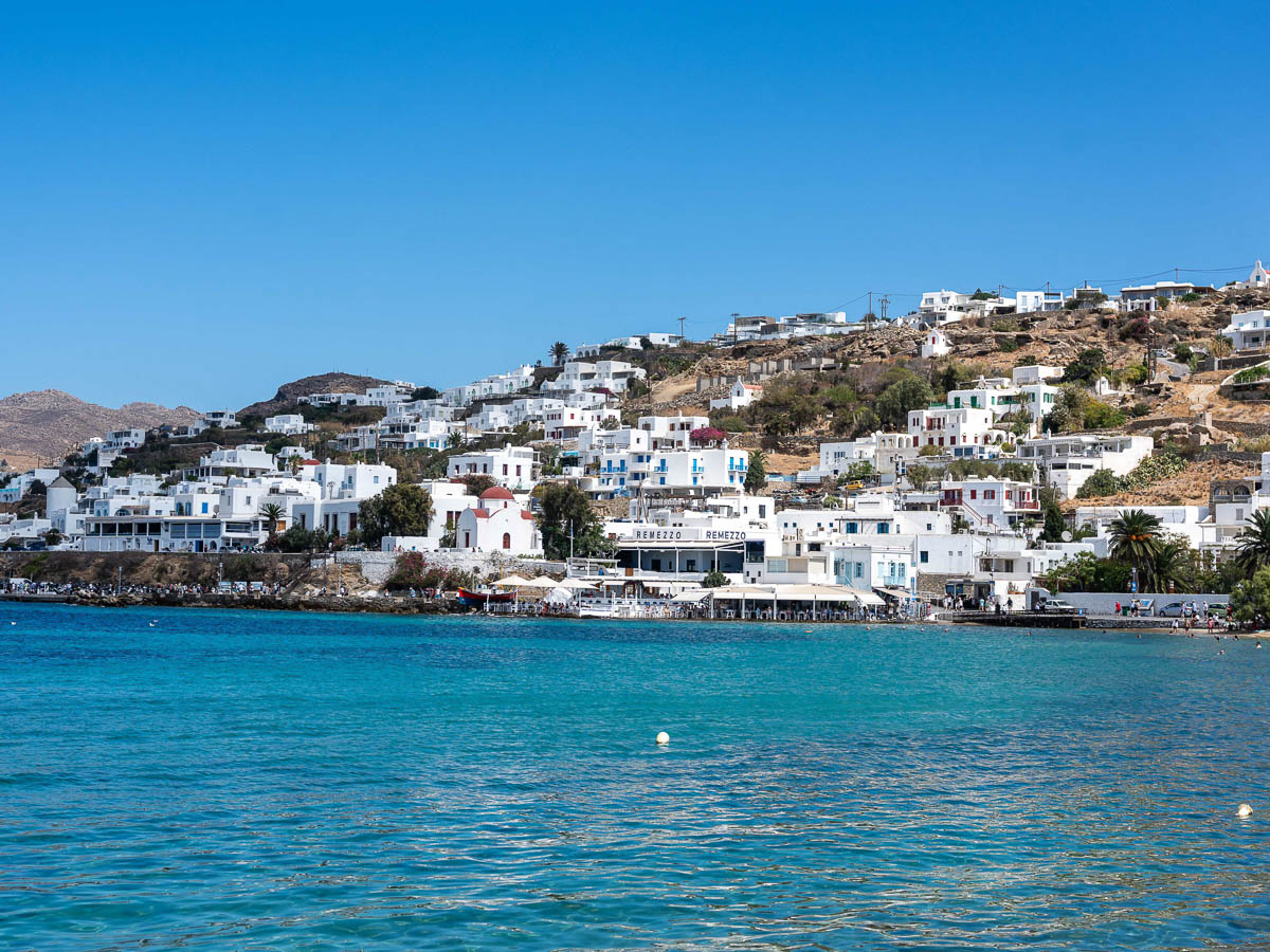Iconic Cycladic church with a blue dome overlooking the Aegean in Mykonos.