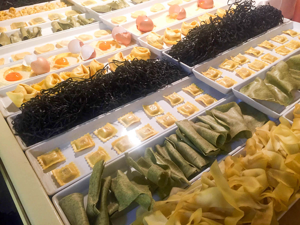 Freshly baked pasta displayed in a Mykonos bakery.