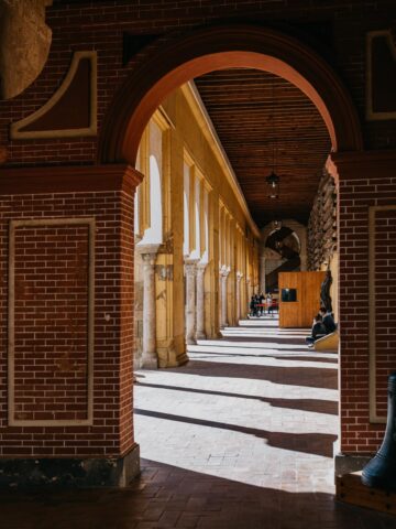 Corridor of striped arches and columns inside the Mezquita-Catedral.