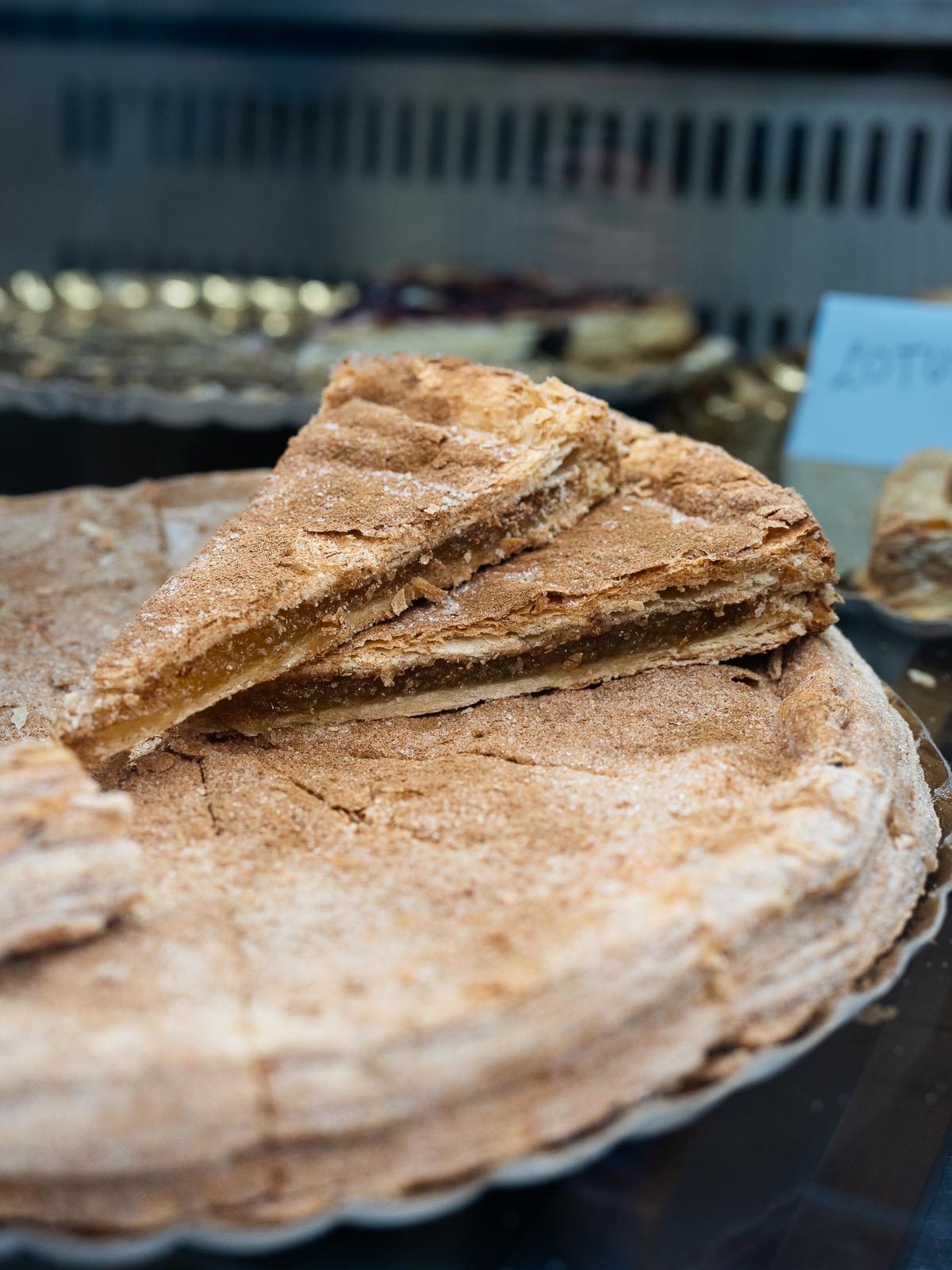 Homemade Pastel Cordobés puff pastry sprinkled with sugar.
